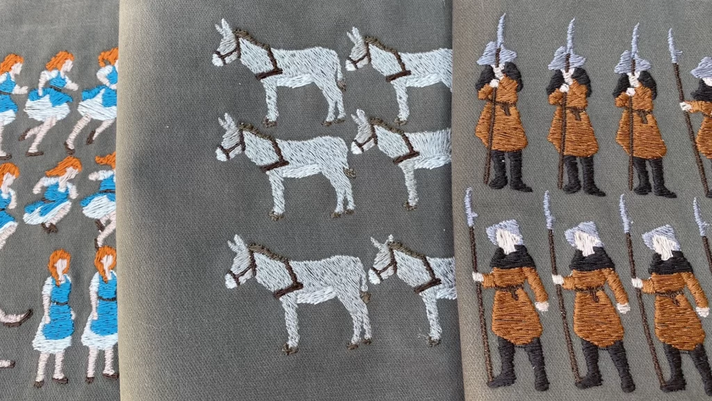 An embroidered sheet of the characters in the game, Scarlet Deer Inn.